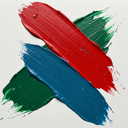 Painted brushstrokes on white paper. Red, blue and green colors.の素材