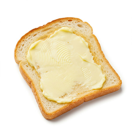 Slice of bread with butter isolated on white background, top viewの素材