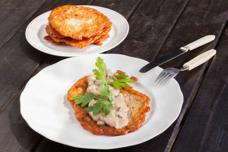 potato pancakes with mushroom sauceの写真素材