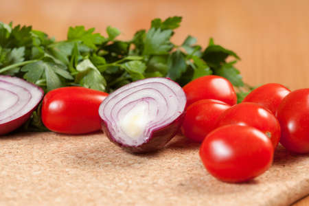 Cocktail tomatoes, onion and parsley の写真素材