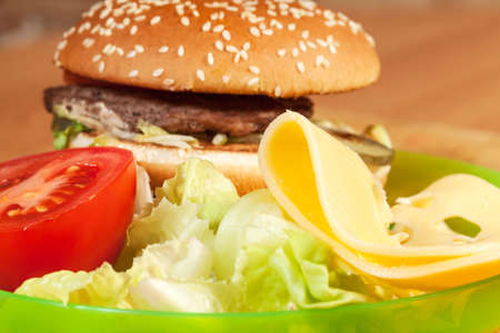 Delicious hamburgers on a wooden tableの写真素材