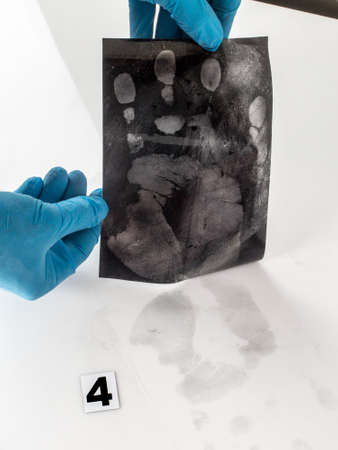 Disclosure of forensic evidence using fingerprint powders.
