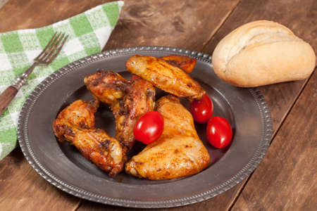 Roast chicken wings on a plate.の写真素材