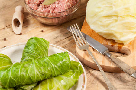 Cabbage rolls stuffed with meat and grits prepared for cooking.