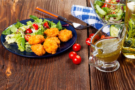 Mixed salad with chicken pieces.の写真素材