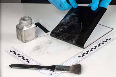 Revealing and preserving the shoe prints- investigation of the scene の写真素材