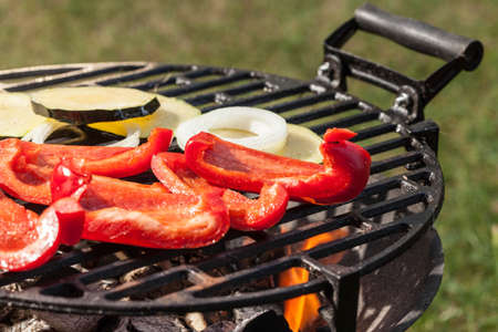 Grilling peppers, onions and zucchini. Selective focus.