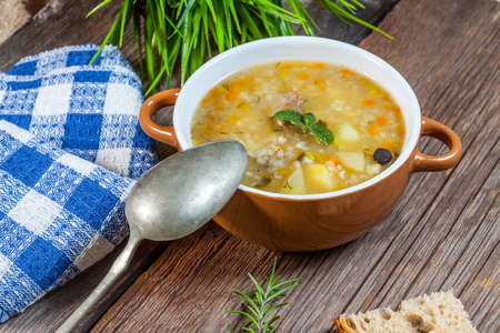 Soup with buckwheat, vegetables and chicken stomachs. Selective focus.の写真素材