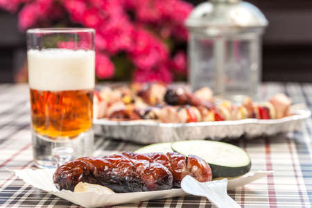 Grilling sausages on barbecue grill. Selective focus.の写真素材