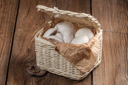 Group of glazed soft gingerbread cookies in an wicker basket.の写真素材