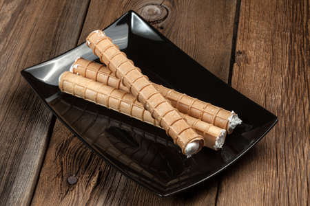 Sweet tube with whipped cream. Selective focus.の写真素材