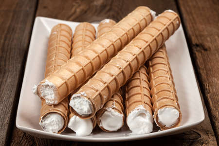 Sweet tube with whipped cream. Selective focus.の写真素材