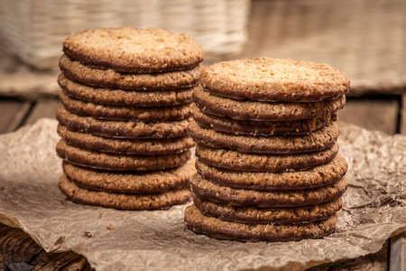 Pile of biscuits on a wooden table. Selective focus.
