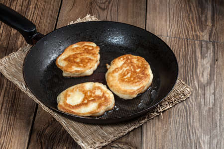 Polish pancakes on wooden board.