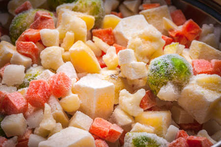 Background of frozen vegetables. Broccoli, carrots, cauliflower, potatoes.の写真素材