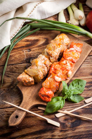 Grilling shashlik on wooden table. Selective focus.の写真素材