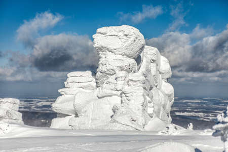 Winter landscape with snow covered rocks.. Krkonose mountains.