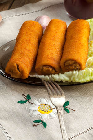Delicious croquettes with meat on a plate.