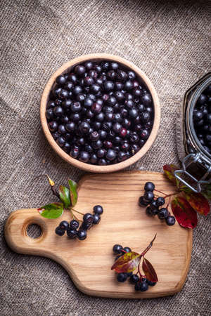 Fruits of black chokeberry prepared for processing. Shallow depth of field.の写真素材