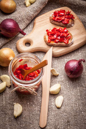Ajvar - delicious dish of red peppers, onions and garlic. Shallow depth of field.の写真素材
