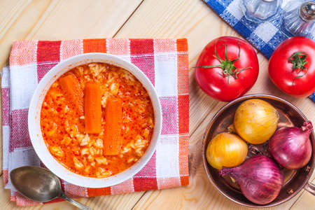 Fresh tomato soup in a white bowl. Top view.