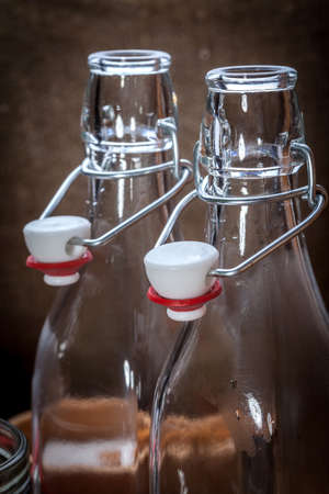 Glass bottle with swing top. Shallow depth of field.