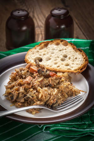 Traditional polish sauerkraut (bigos) with mushrooms and meat. Shallow depth of field.の写真素材