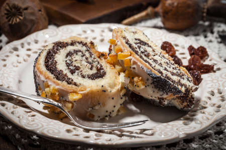 Pieces of poppy seed cake on a plate. Selective focus.