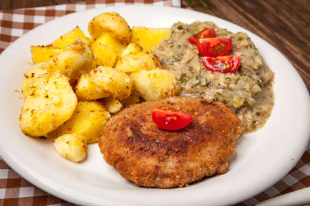 Delicious meal of minced meat cutlet, potatoes and fried cabbage. Selective focus.の写真素材