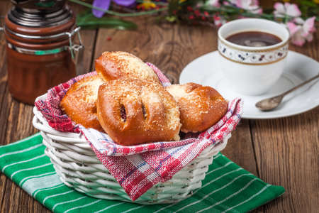Buns with berries on a wooden table. Shallow depth of field.の写真素材