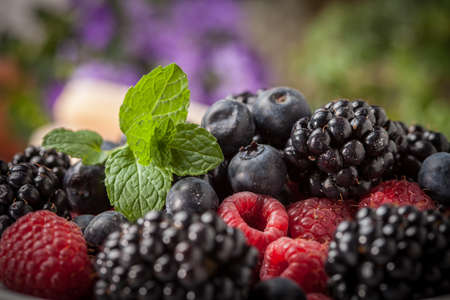 Mix of berries in a bowl. Selective focus.の写真素材