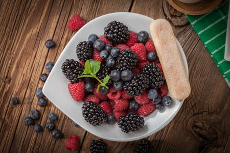 Mix of berries in a bowl. Selective focus. Top view.の写真素材