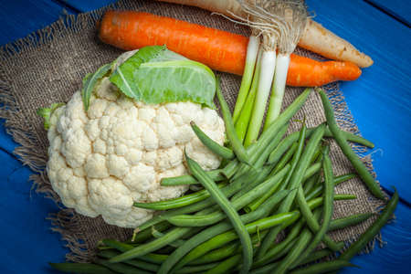 Vegetables from the home garden in a wooden box. Selective focus.の写真素材