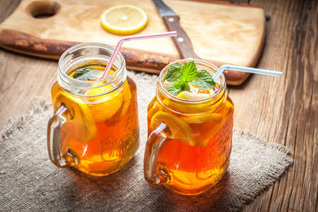 Fresh homemade ice tea with lemon and mint.の写真素材