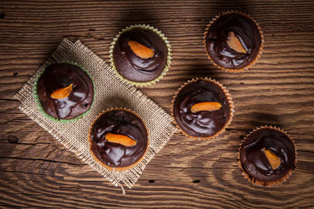 Tasty and fresh - homemade chocolate muffins. Shallow depth of field.の写真素材