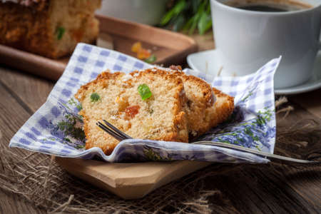Traditional Christmas cake with candied fruit, raisins and fruits. Selective focus.