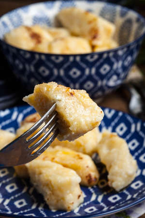 Lazy dumplings with cinnamon and sugar. Dark light.の写真素材