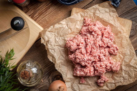 Raw minced meat on wooden background. Selective focus.の写真素材