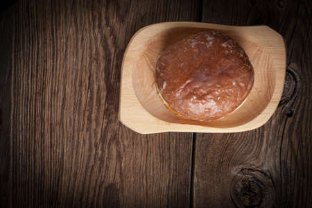 Traditional sweet donut on a wooden table.の写真素材