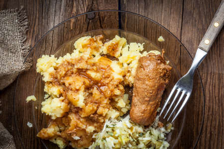 Tasty roulades beef on plate with sauce, salad and mashed potatoes. Top view.