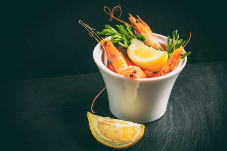 Shrimps for dinner on stone plateの写真素材