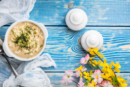 Tasty mushroom soup with noodles on a wooden table. Shallow depth of field.  Top view and copy space.の写真素材