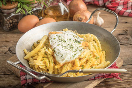 Fried egg served with yellow beans on pan.の写真素材