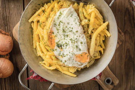 Fried egg served with yellow beans on pan. Top view.の写真素材