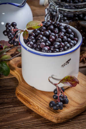 Fruits of black chokeberry prepared for processing. Shallow depth of field.の写真素材