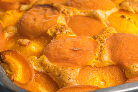 Tart with apricots on wooden table background.の写真素材