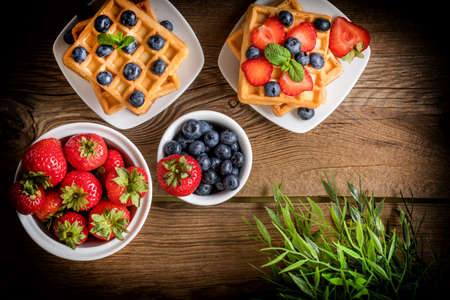 Waffles with berries. Selective focus. Top view.の写真素材