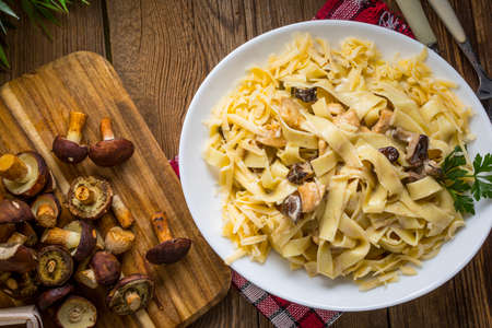 Tagliatelle pasta with forest mushrooms and chicken. Small depth of field.の写真素材