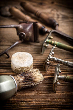 Vintage barber shop tools on old wooden background. Small depth of field.の写真素材