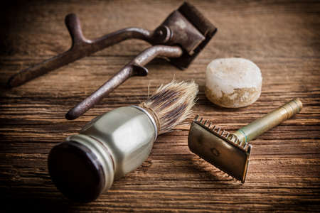 Vintage barber shop tools on old wooden background. Small depth of field.の写真素材